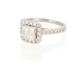 3022
A Diamond Ring
Centering 4 princess-cut diamonds totaling approximately .10 carat, further accented by 22 round brilliant-cut diamonds weighing approximately .20 carat, set in 14K white gold

3.4 grams gross
Ring Size: 5
Estimate: $200 - $300
