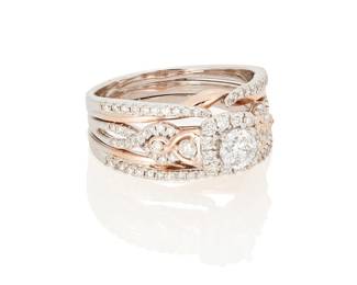 3023
A Diamond Ring
Centering a round brilliant-cut diamond weighing approximately .25 carat accented by 68 round brilliant-cut diamonds weighing approximately .70 carat, set in 14K white and rose gold

10.9 grams gross
Ring Size: 10
Estimate: $400 - $600