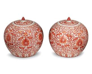3081
20th century
A Pair Of Chinese Lidded Porcelain Jars
Each appears unmarked
Each with all-over dense stylized vine, lotus, and peach motifs in red enamel on a white ground, 2 pieces
Each: 10" H x 8.5" Dia.
Estimate: $300 - $500