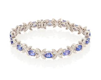 3039
A Tanzanite And Diamond Bracelet
Featuring 14 oval-shaped tanzanites weighing approximately 7.40 carats, and 52 round brilliant-cut diamonds weighing approximately .55 carat, set in 14K white gold

24.2 grams gross
7.5" L
Estimate: $1,200 - $1,500