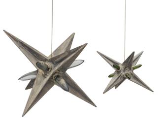 3476
Christopher Lee
b. 1951
Two Multi-Point Stars
Metal and glass
Each unmarked
The cast metal stars with applied glass nodes and hanging hardware
Larger: 14" Dia.; Smaller:7.75" Dia.
Estimate: $300 - $500