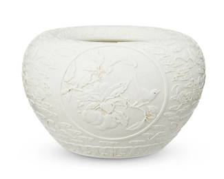 3079
20th century
A Chinese Carved Earthenware Alms Bowl
Embossed to the underside bearing an apocryphal reign mark for Qianlong Period (1736-1795)
The crisply incised bowl, with an all-over white glaze, displaying bird and flower reserves on a bat and cloud ground
5.5" H x 8" Dia.
Estimate: $800 - $1,200