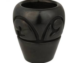 3144
Mela Youngblood (1931-1991, Santa Clara Pueblo)
A Santa Clara blackware pottery jar, 1970
Signed and dated to base: Mela Youngblood / Santa Clara Pue / 11-2-70
The carved cylindrical blackware jar with curvilinear banded motif
4.5" H x 4.125" Dia.
Estimate: $400 - $600
