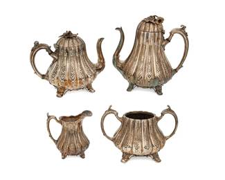 3073
Circa 1835-1872
A Shaw & Fisher Silver-Plated Tea And Coffee Service
Coffee and tea pots stamped: Shaw & Fisher / Sheffield; each marked: 1497
Comprising a coffee pot (8.875" H x 8.5" W x 6.25" D) and a tea pot (7" H x 8.5" W x 5.875" D), each with hinged lids and ivy finials, an open sugar with opposed handles (5.375" H x 8" W x 5.375" D), and a creamer (4.5" H x 4.75" W x 3.375" D), 4 pieces
Estimate: $200 - $400