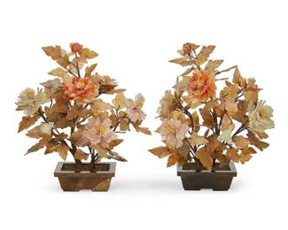 3077
Mid/late 20th century
A Pair Of Chinese Carved Stone Trees
Each unmarked
The trees decorated with carved rose quartz and translucent orange hardstone peony flowers and stone leaves, affixed to woven fabric-encased and pliable "branches," stemming from a painted plaster trunk, set in a weighted marble footed pot, 2 pieces
Each: 17" H x 13.5" W x 9" D approx., dimensions variable
Estimate: $300 - $500