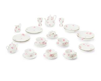 3069
Late 20th century
A Limoges D. Porthault Pink "Coeurs" Porcelain Tea Service
Marked to underside: Giraud / Limoges / France; further marked: D. Porthault / Made in France
Designed by D. Porthault and manufactured by Giraud & Co, comprising 1 lidded tea pot (6.5" H x 8" W x 5" D), 1 creamer (3.875" H x 4" W x 3.125" D), 1 covered sugar (4.5" H x 4.875" W x 3.625" D), 1 covered honey (3.25" H x 3.625" Dia.), 2 footed cups (4.25" H x 3" Dia.), 2 teacups (2.125" H x 4" Dia.), 2 saucers (5.75" Dia.), 2 bowls (8.25" Dia.), and 2 luncheon plates (8.75" Dia.), sold together with a group of 13 near-matching teacups, saucers, bowls, and plates of the same maker and designer in a similar pattern of pink clovers, 27 pieces
Estimate: $200 - $300