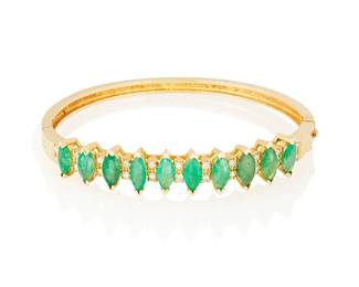 3032
An Emerald And Diamond Bangle
Set with 10 marquise-cut emeralds totaling approximately 4 carats, accented with .22 carat round brilliant-cut diamonds, in 14K gold

19.4 grams gross
2" Dia
Estimate: $300 - $500