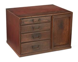 3114
Late 19th/early 20th century
A Japanese Ko Tansu Chest
The wood small personal storage chest with metal handles, four drawers of graduated sizes, and one large side compartment with set-in wood door/lid
13.125" H x 19.5" W x 14.5" D
Estimate: $200 - $400