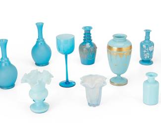 3199
20th century
A Group Of Blue Milk Glass Table Items
The group of blue milk glass items comprising a footed urn with banded gilt accents, five long-neck vases with various gilt or painted accents, two handkerchief vases, and a stemware glass, 9 pieces
Urn: 9.125" H x 4.5" Dia.; Smallest: 5.125" H x 2.625" Dia.
Estimate: $150 - $250
