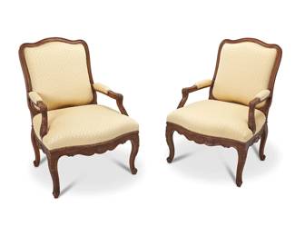 3121
Late 19th/early 20th century
A Pair Of Louis XV-Style Armchairs
Each with a carved walnut carcass and cream upholstered seat, back, and elbow pads with nail head trim and shell motifs, 2 pieces
Each: 42" H x 28" W x 28" D
Estimate: $300 - $500