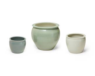 3233
Late 20th/early 21st century
Three Ceramic Jardinières
Comprising three glazed ceramic pots in shades of green, celadon, and teal, each of similarly conforming design in graduated sizes, 3 pieces
Largest: 18.25" H x 22" Dia.; Smallest: 10" H x 12" Dia.
Estimate: $200 - $400
