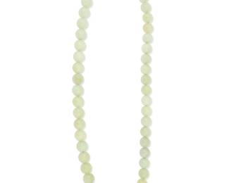 3020
A Jadeite Bead Necklace
Designed with 50 jadeite beads measuring approximately 14.0 mm with a silver clasp

194.74 grams gross
24" L
Estimate: $400 - $600
