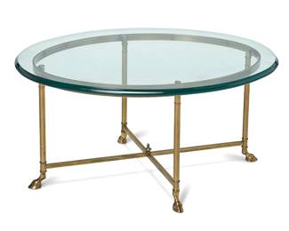 3204
Circa 1960s
A Labarge Hollywood Regency Cocktail Table
The brass oval table with x-stretcher and hoof feet, surmounted by a beveled glass top
16.75" H x 34.75" W x 26" D
Estimate: $200 - $400