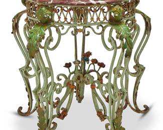 3126
20th century
A Wrought Iron Table With Marble Top
The polychrome enameled wrought iron table with undulating and banded scroll frame and four legs wrapped in a leaf motif over a scrolled x-stretcher centering a group of roses, surmounted by a red beveled marble top
30.75" H x 31" W x 31" D
Estimate: $600 - $800