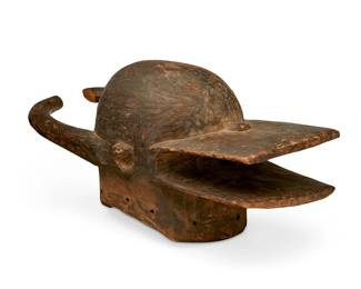 3162
Late 19th/early 20th century; Côte d'Ivoire
An African Senufo Firespitter Mask
Unmarked
The carved and patinated wood helmet mask with single eyehole
12" H x 10.25" W x 27.5" D
Estimate: $500 - $700