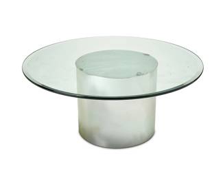 3211
Circa 1980s
A Brueton-Style Polished Chrome And Glass Cocktail Table
The contemporary table with a polished, cylindrical chrome base and a circular glass top
20.5" H x 48" Dia.
Estimate: $200 - $400

