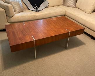 Vintage Swedish coffee table in walnut with steel base 56’long  x 29”D x 161/2 H
Wonderful slipvovered sectional sofa  in ultra suede. 