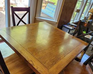 HEAVY wood dining set. Table sides fold to make it square or round.  Comes with 6 heavy chairs.