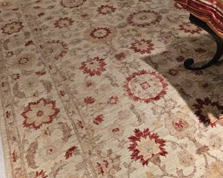 This Persian carpet is approximately 11x14 and has light neutral tones along with a pinch of red coloring. Very pleasant backdrop for any room. Natural dyes and handspun, finer weave.