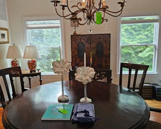 Large round dining room table with six chairs. Chairs have custom animal print fabric. The set was purchased @ Domicile. Like new!