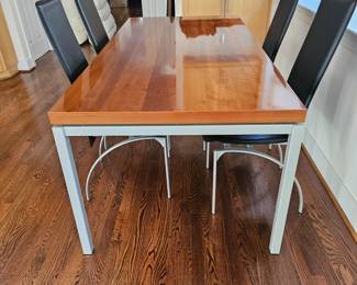Like new contemporary dining table and four chairs. Purchased in Georgetown.