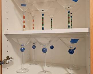Several sets of Martini glasses.
