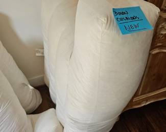 These are two down filled seat cushion for a sofa... brand new! Along with one chair seat cushion. ALL DOWN !!!