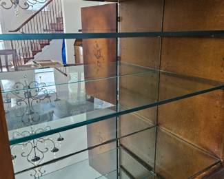 Glass shelving and mirror backed.