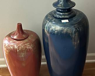 Pair of ceramic tall pots with lids in orange and blue with gold accent