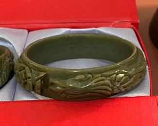 Two lovely bangle bracelets, carved nephrite jade, in case