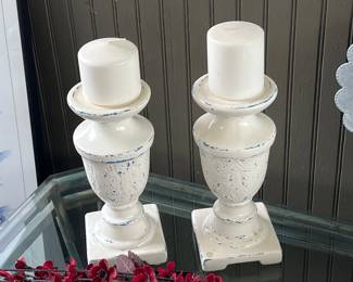 Pair of distressed white candleholders with candles