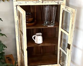 Unique cabinet with shelves and arched double top, glass doors