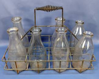 Metal Milk Carrier With Glass Milk Bottles Including Dixie Dairy Company One Quart Bottle, And 6 Unbranded Bottles, Various Sizes, Total Qty 7