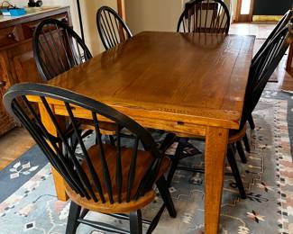 Country Solid Wood Table with Two Breadboard Style End Leaves. Measurements are: 68" x 44" without the leaves and each leaf adds 18" 