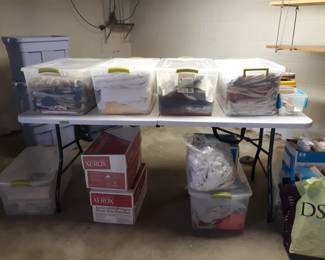 Several boxes of fabric and patterns for the sewing enthusiast
