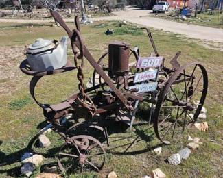 #1212 • Antique John Deere Plow with Sign
