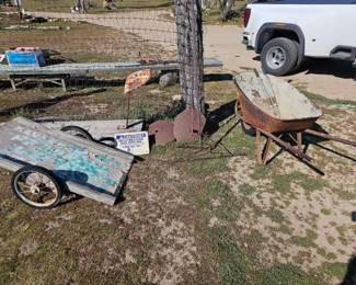 #1242 • Wheel Barrow, Tractor Seat, Cart, Rakes, Sign and Stands
