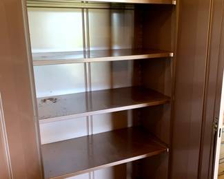 #142	Gray Metal Boroughs Cabinet 36x18x79	 $100.00 			
