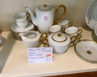 #232 Okura tea set white gold 8 piece set 	 $50.00 			
