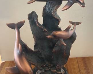 Bronze dolphin statue