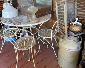 Waterman's display cabinet, milk can, metal table & chairs