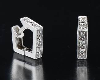 A Pair of Gold and Diamond Earrings 