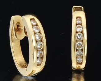 A Pair of Gold and Diamond Oval Earrings 