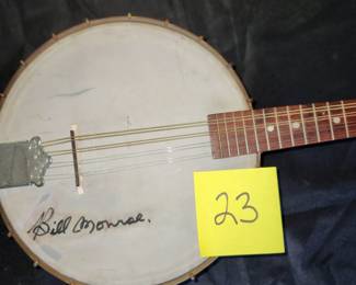 old banjolin with signature of Bill Monroe