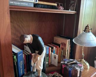 Golf statue and Books