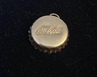 Coca-Cola bottle cap pendant with 24k 1/10 ozt gold Maple Leaf coin....see next photo