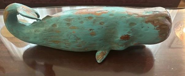 Wooden whale sculpture