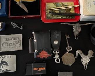 Belt buckles, Harley Davidson collectables, knives, harmonicas and other misc.