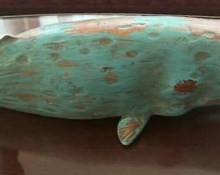 Wooden whale sculpture