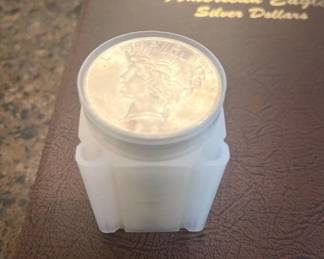 ROLL OF SILVER DOLLARS